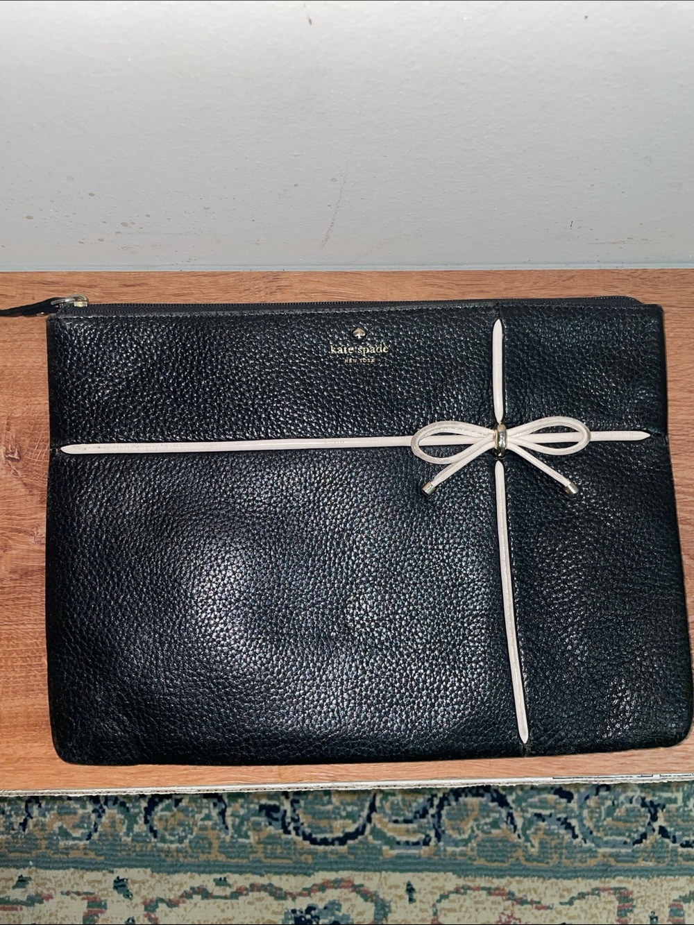 kate spade Black Pebbled Leather Bow Zip Pouch with Cream Trim